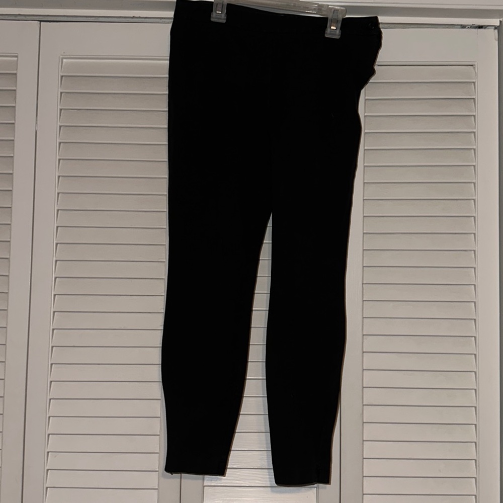 chico’s black tapered trousers with side-zippers on pant legs